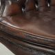 Brown cow leather Chesterfield office chair on wheels in English style