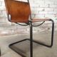 pair of tubular chairs in tawny leather