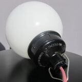 Trio of opal glass and bakelite globe pendant lights