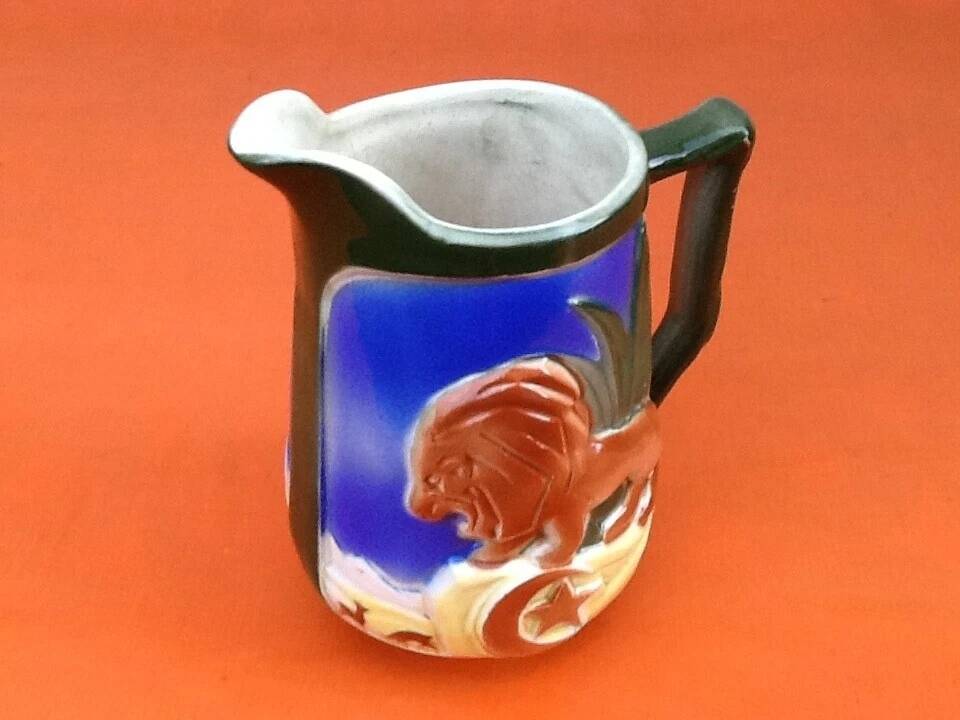 Pichet barbotine decorated with a lion, St-Clément Manufacture, France.