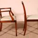 set of 10 chairs and two mahogany armchairs in Hepplewhite style