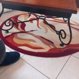 Coffee table in cherry wood with a wrought iron base.