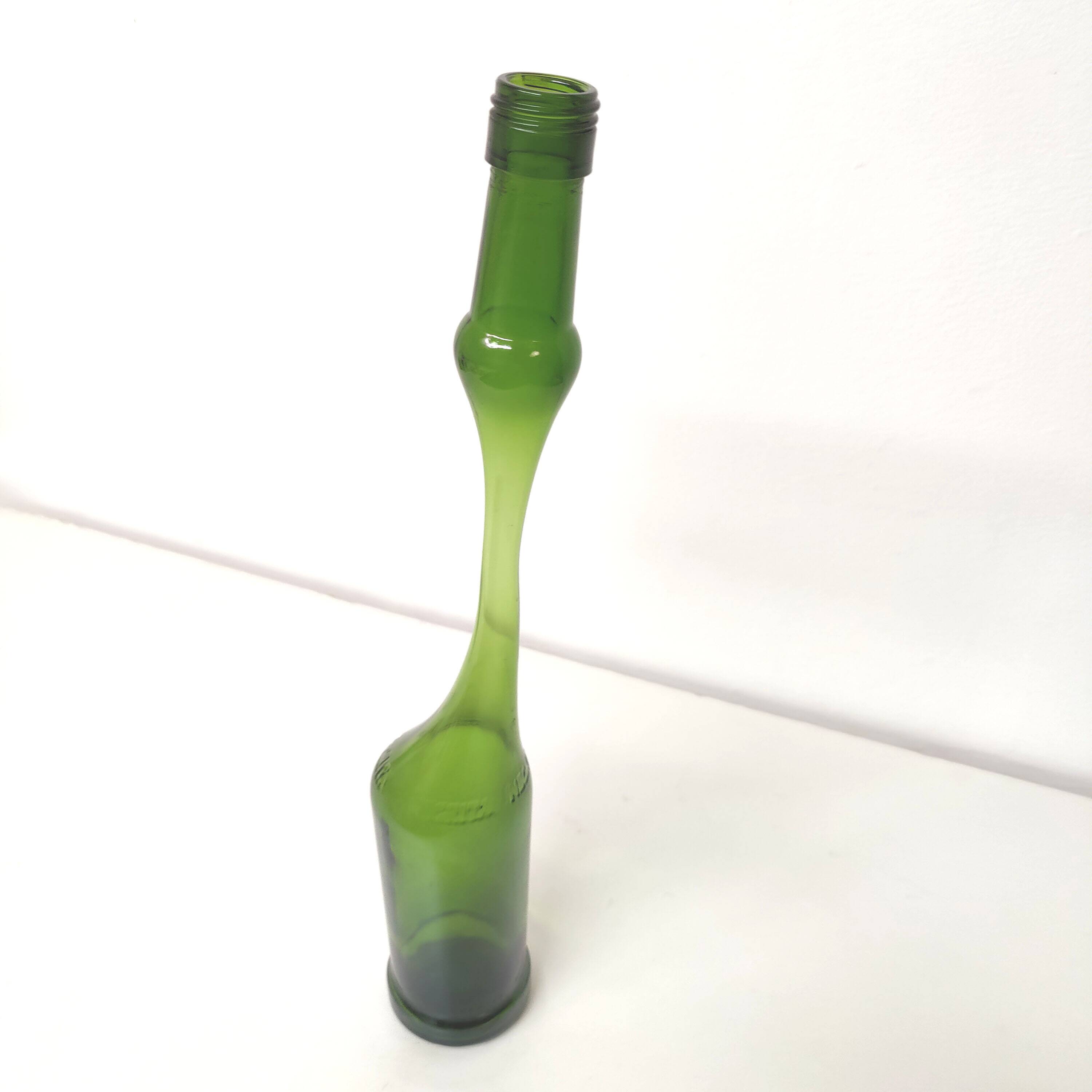 Green Negrita rum bottle atypical distorted decanter vase