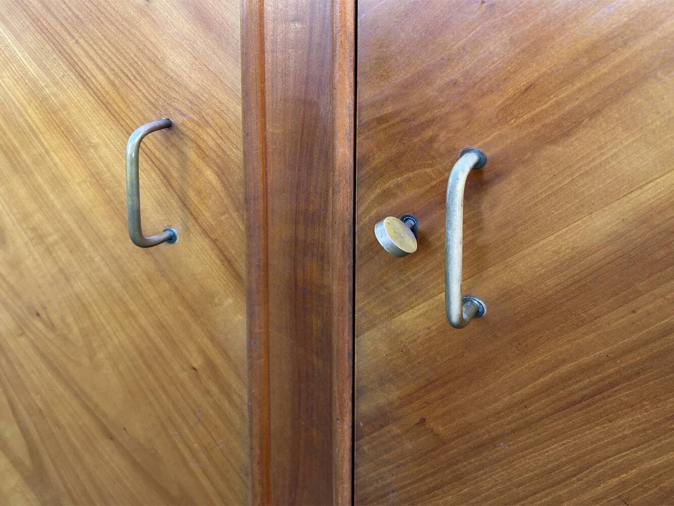 Mid-century wardrobe from the 1960s in wood, with a chevron front and tapered legs.