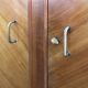 Mid-century wardrobe from the 1960s in wood, with a chevron front and tapered legs.