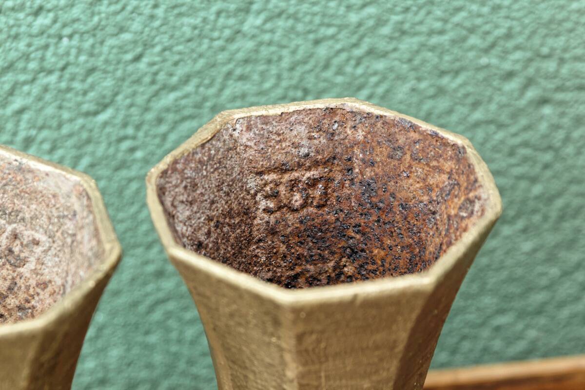 Pair of cast iron cone vases, art deco