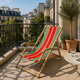 Vintage deck chair with striped green and red fabric, original patina.