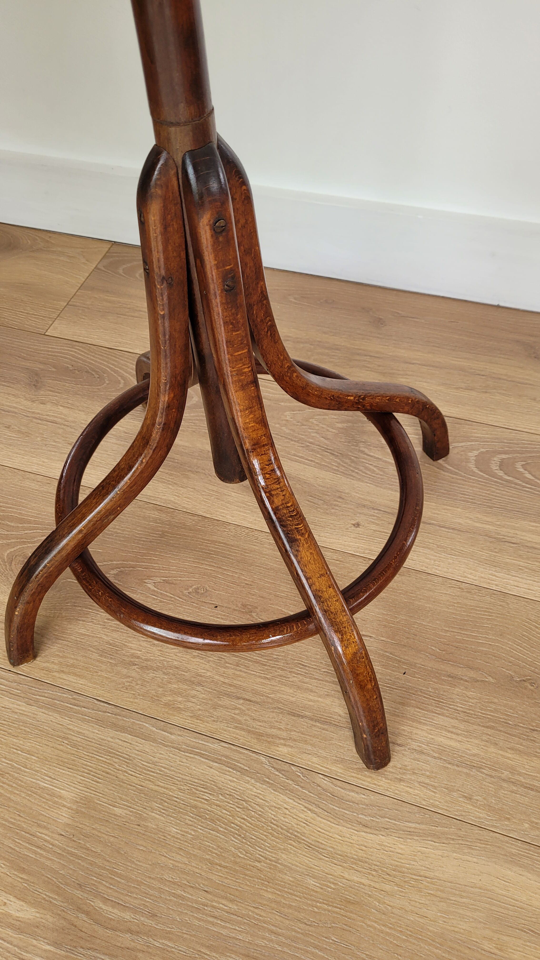 Wooden parrot coat rack on foot