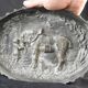 Bronze dish decorated with animals and children