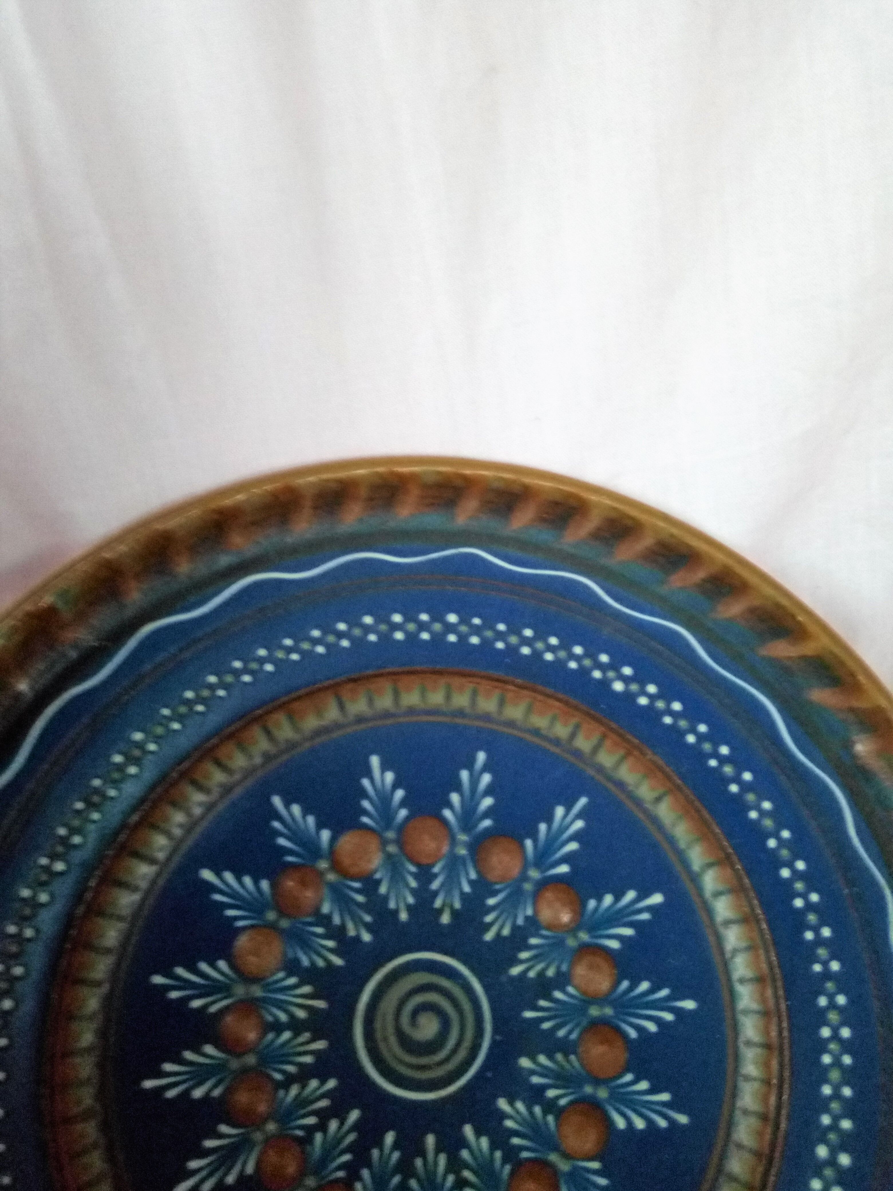 Plate in painted sandstone