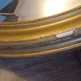 Antique large oval beveled mercury mirror