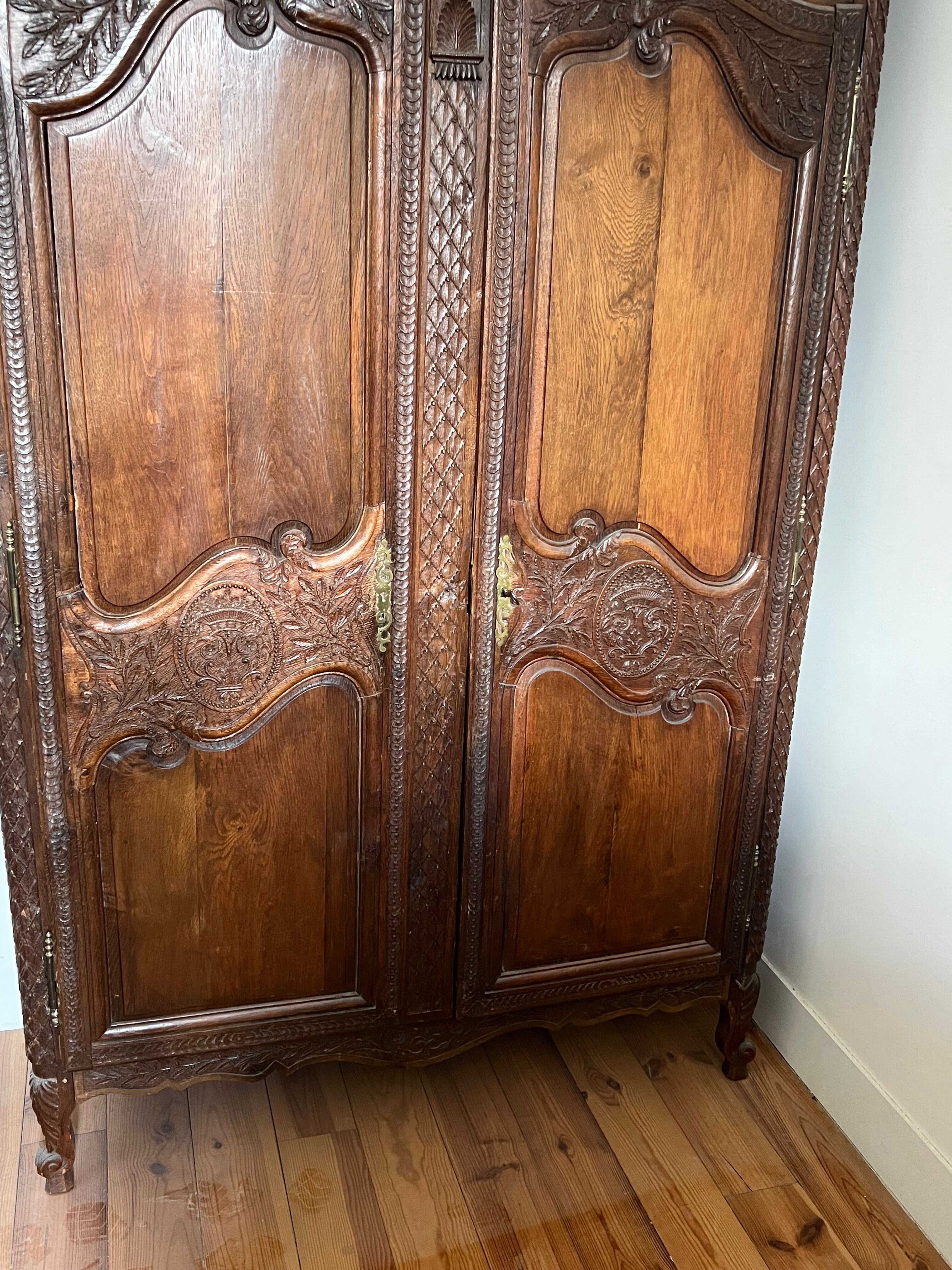 Beautiful and ancient Norman wedding wardrobe, richly carved