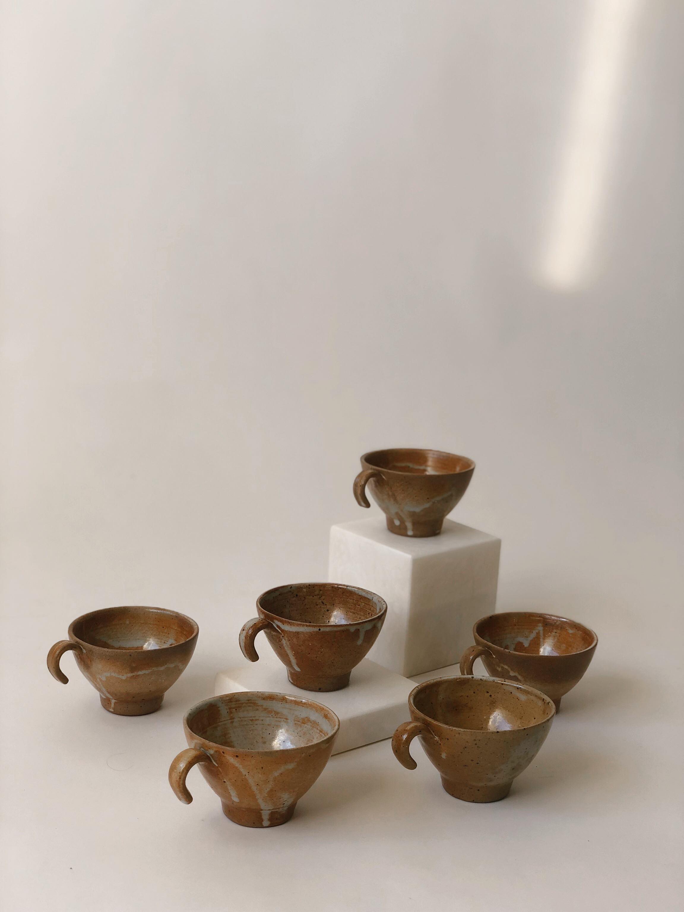 Suite of 6 sandstone cups