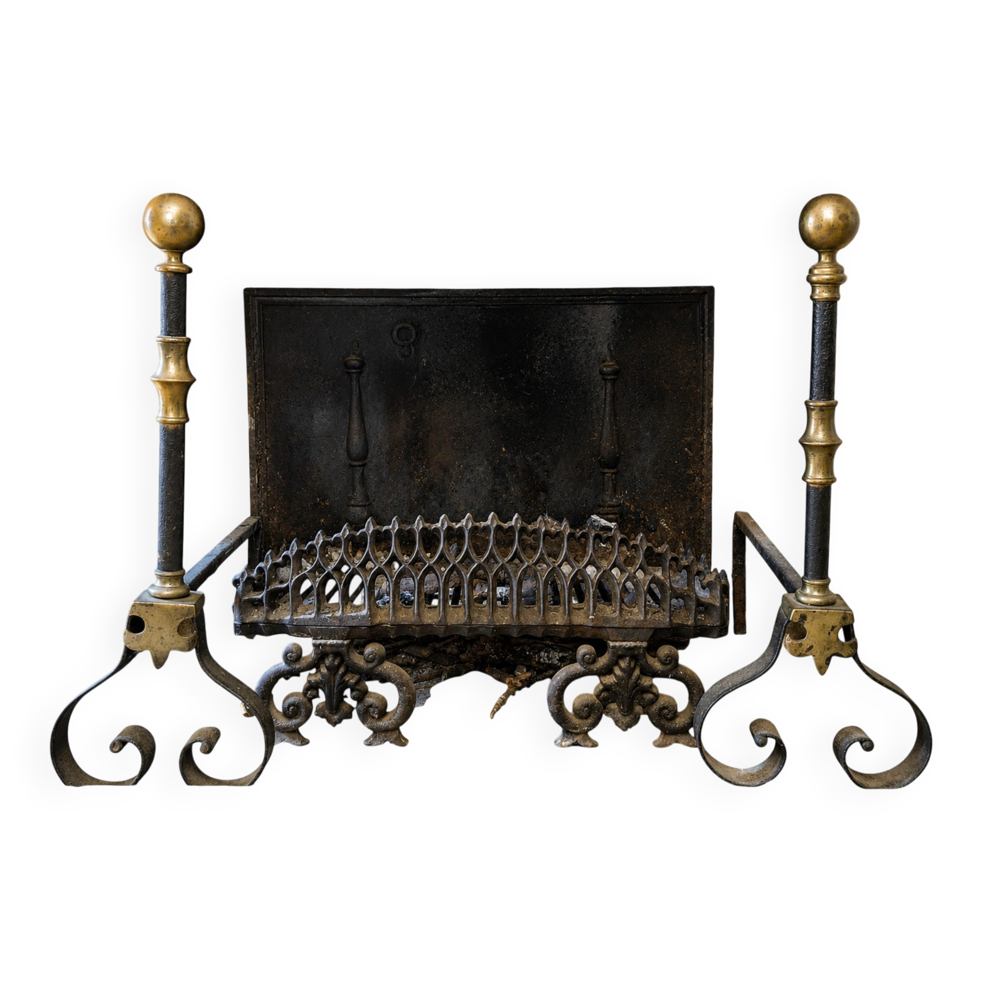 Pair of wrought iron and brass fire dogs with a log holder, 19th century.