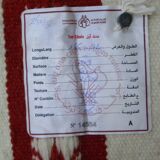 Tribal bohemian kilim rug with geometric pattern in wool.