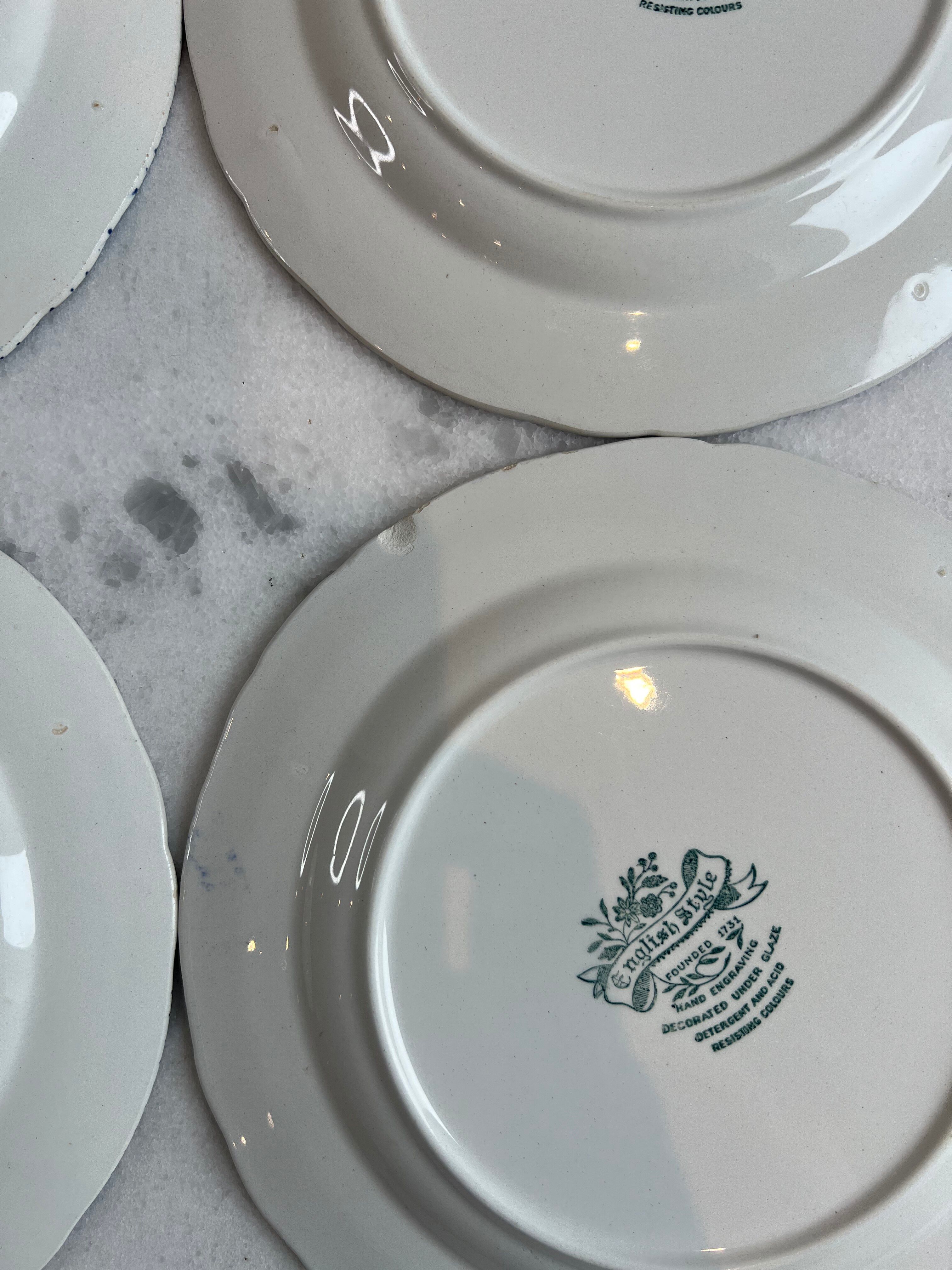 Set of four flat plates from English earthenware.