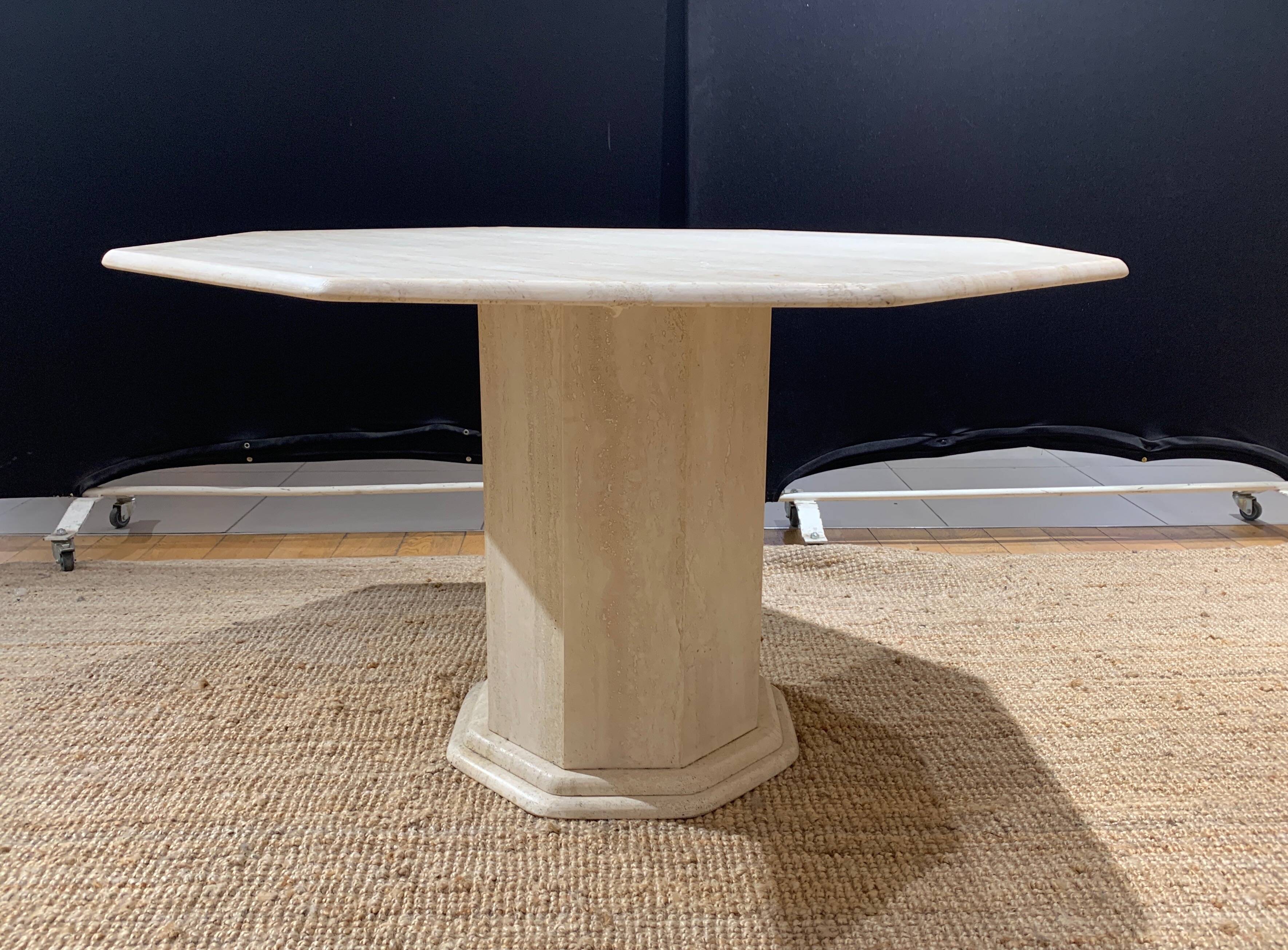Octagonal table in light travertine