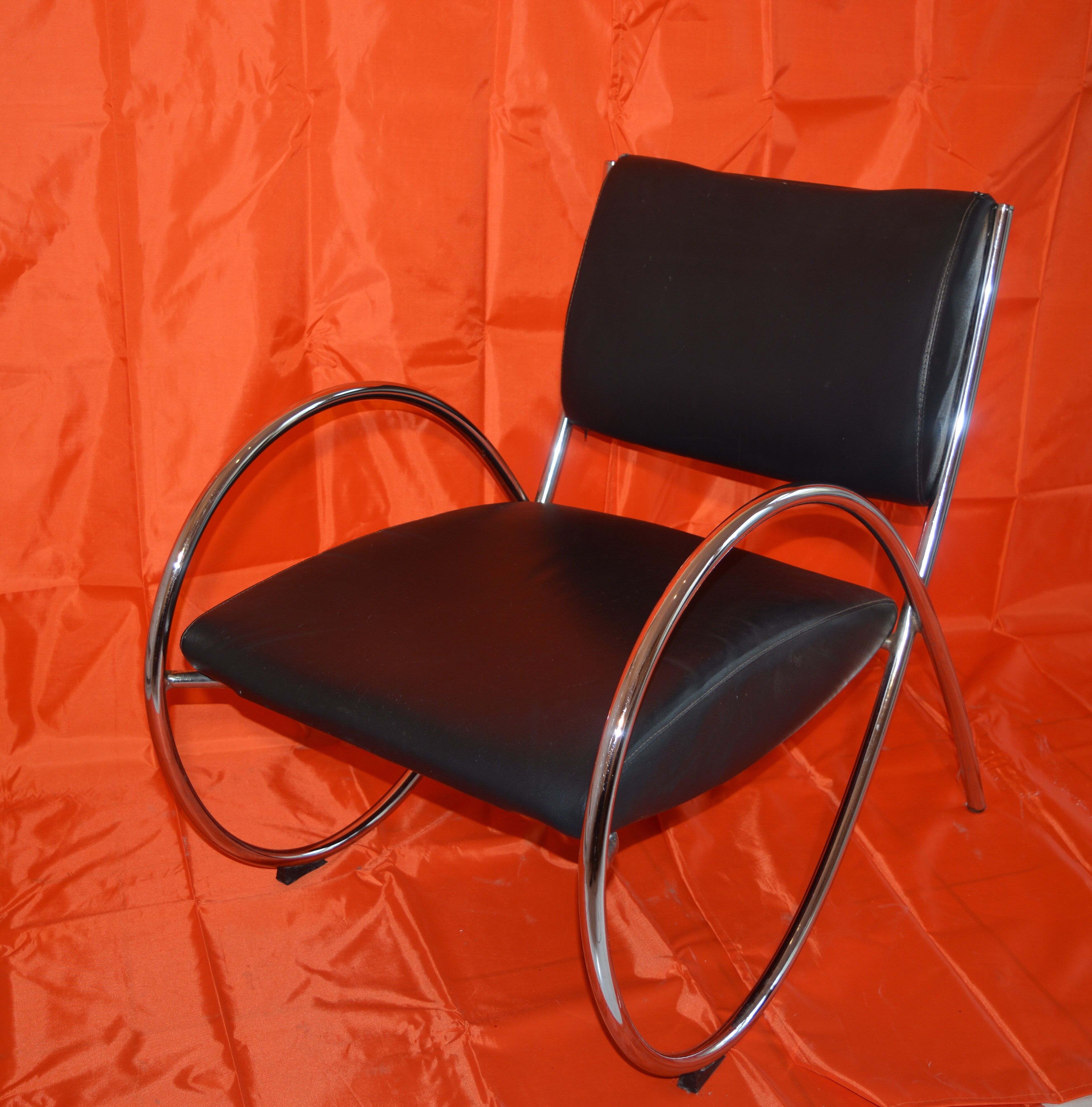 Vintage armchair in imitation leather and chrome steel tube