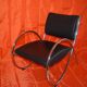 Fauteuil vintage en simili cuir et tube d'acier chromé