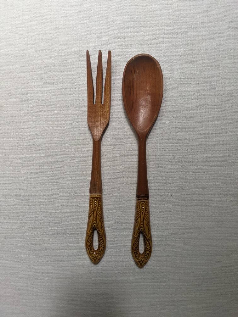 Antique wooden salad servers with earthenware handles, handcrafted