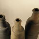 Three old sandstone bottles