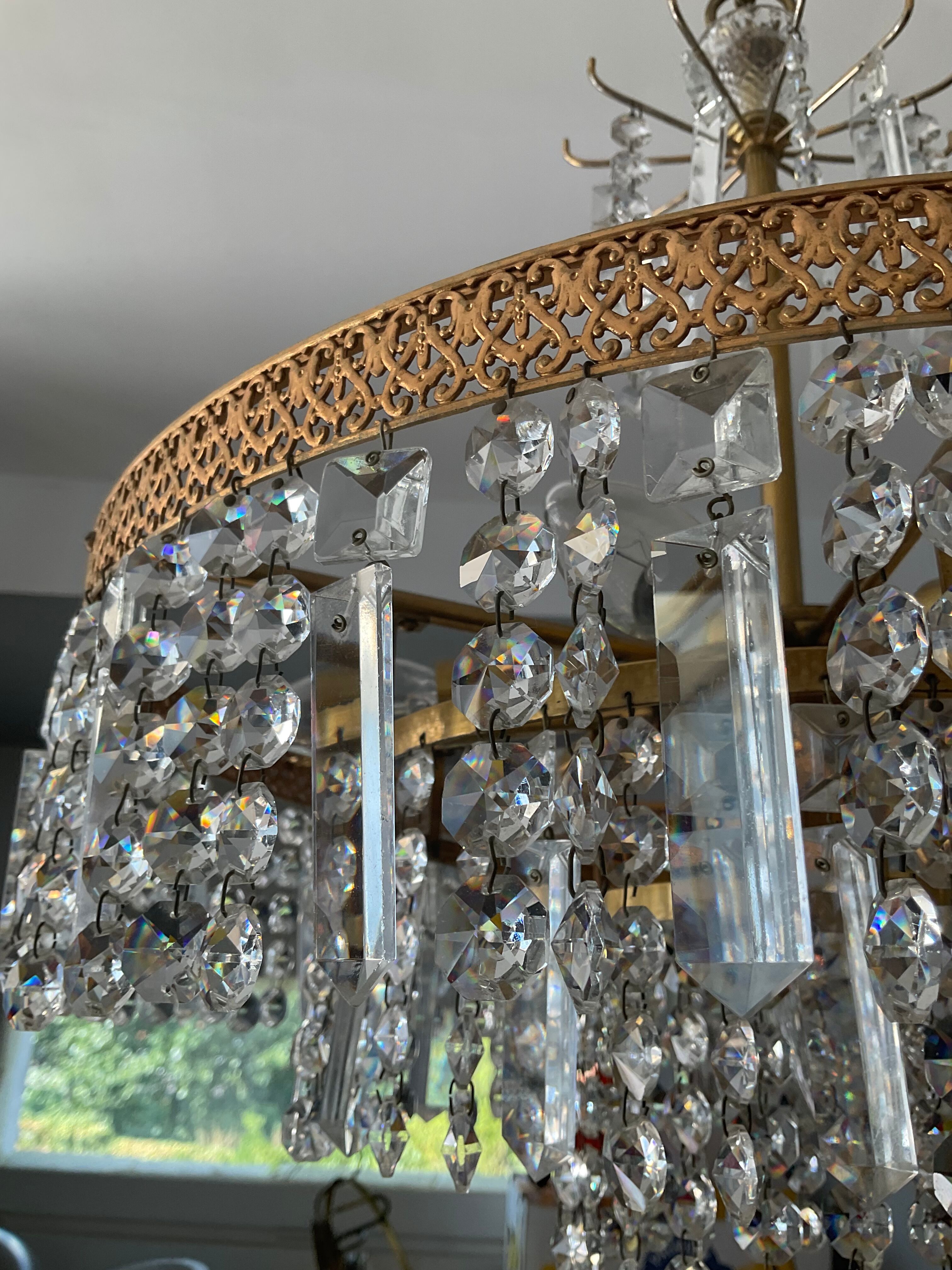Old brass chandelier and crystal grapevines
