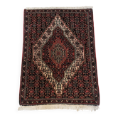 Tapis persan ancien laine tons rouge noué main