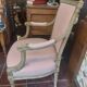Patinated Louis XVI style armchair