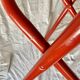 Vintage folding chair in red painted metal and wood