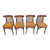 4 bentwood bistro chairs with a pattern on the seat