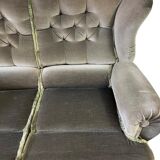 Vintage green two-seater sofa with fringes