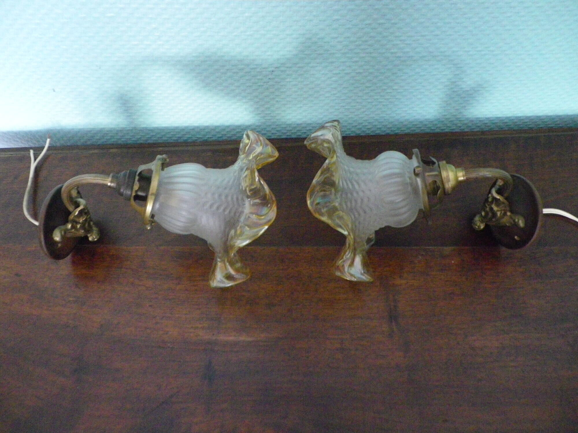 Wall lamps, opaque corolla and iridescent ochre lampshade, brass and wood support