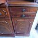 Scribanne bookcase in mahogany veneer English work of the twentieth century