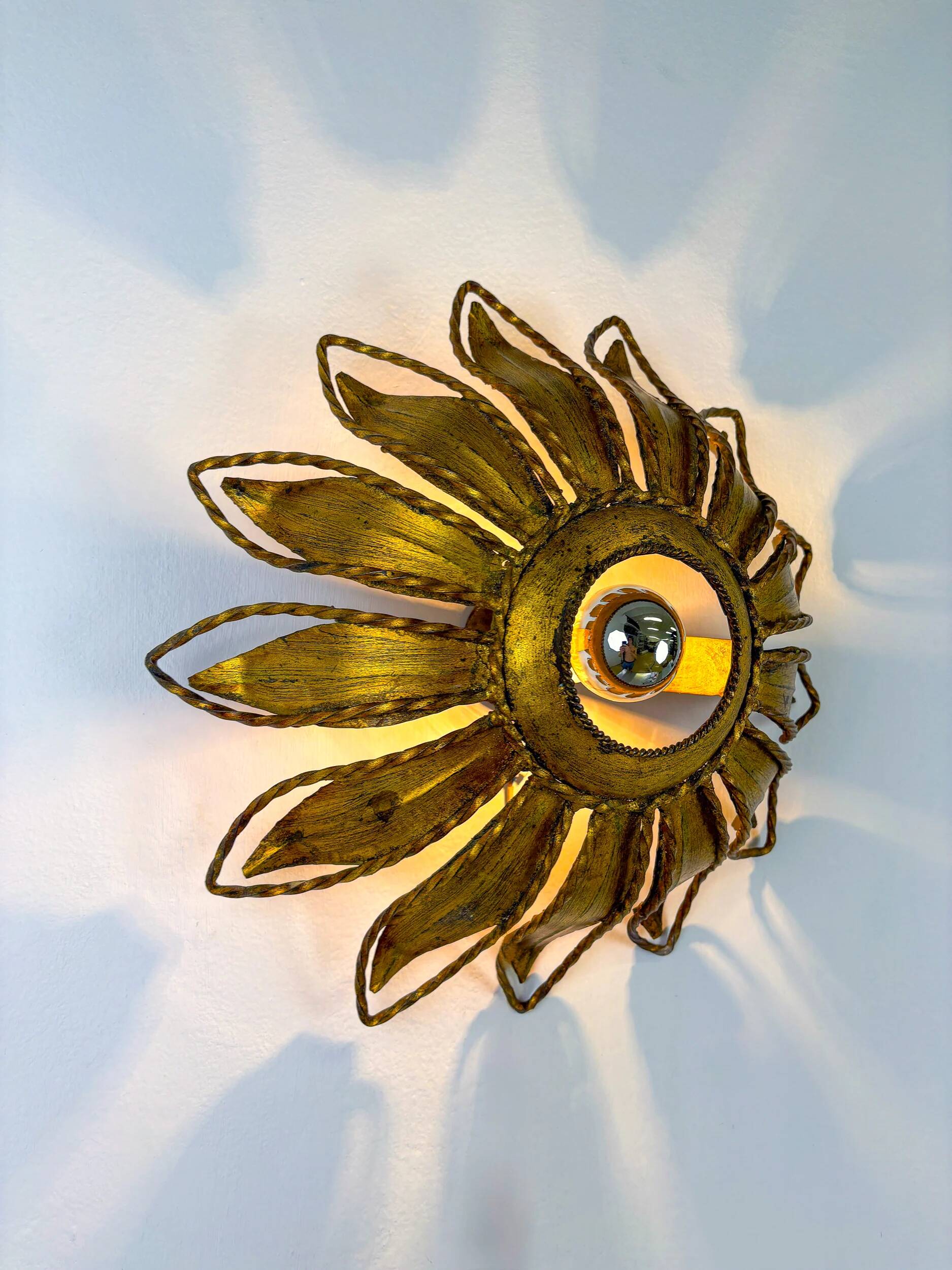 Spanish sunburst ceiling light fixture or sconce in gilt iron, circa 1960