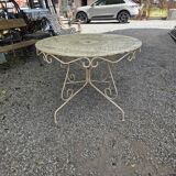 Old garden table in solid wrought iron