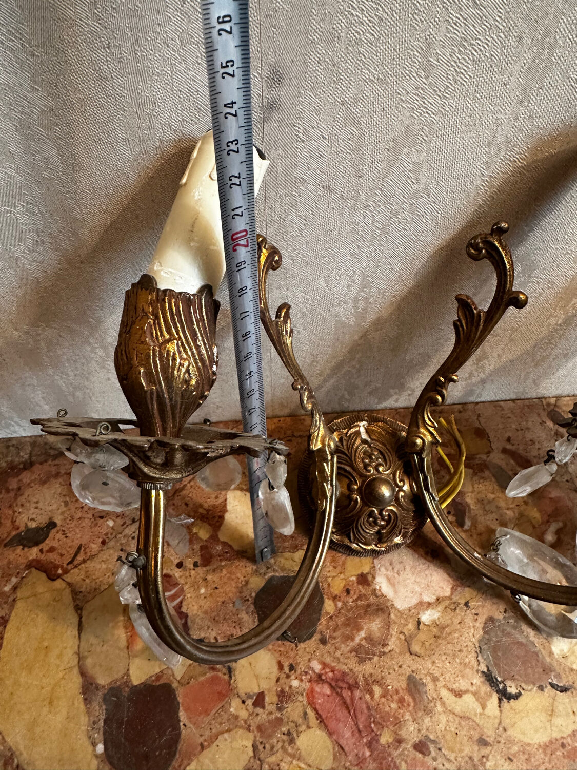 Pair of Louis XV style wall sconces in gilded bronze with glass pendants.