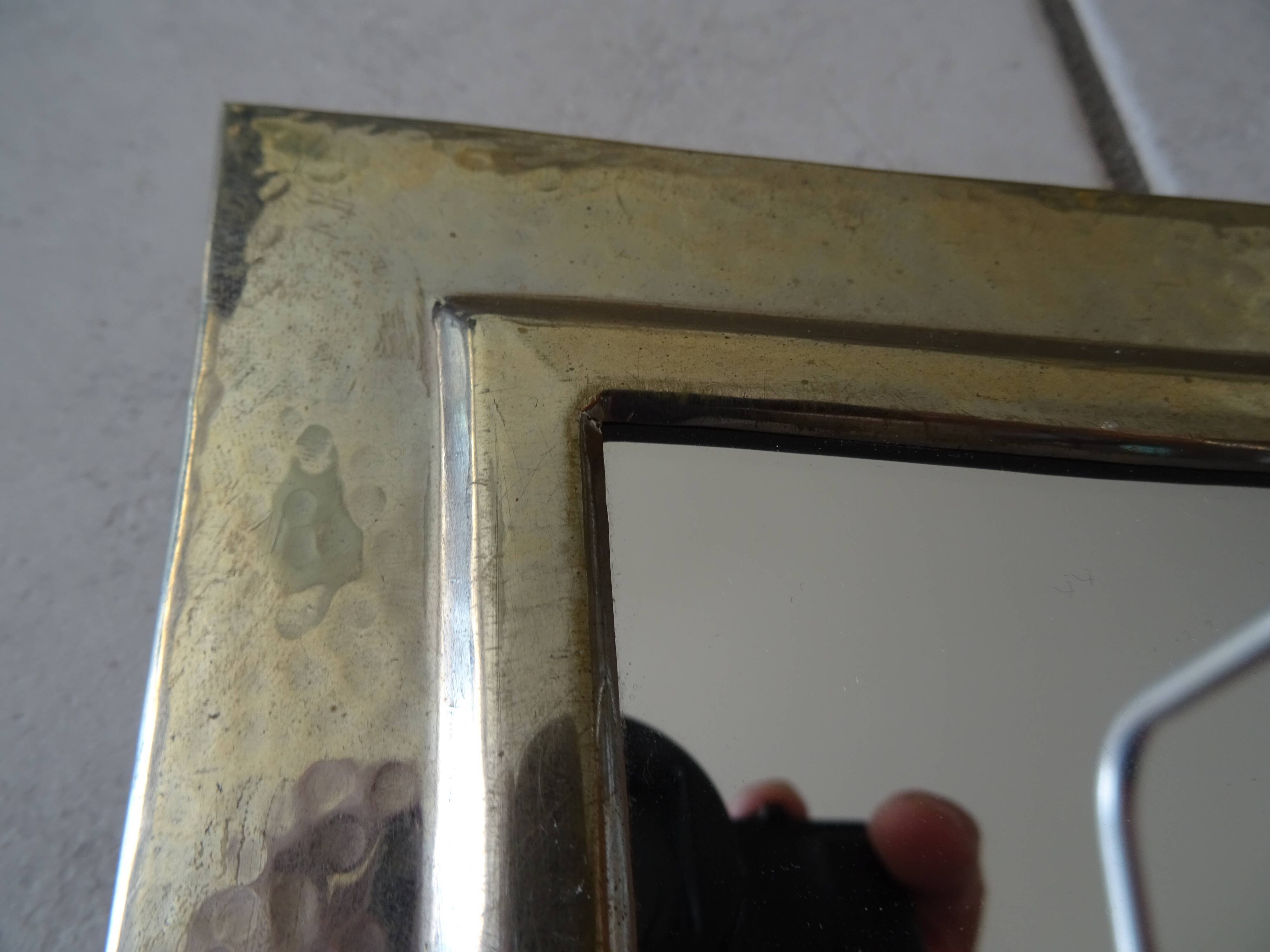 Hammered metal mirror design