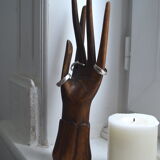 Carved wooden baguier hand