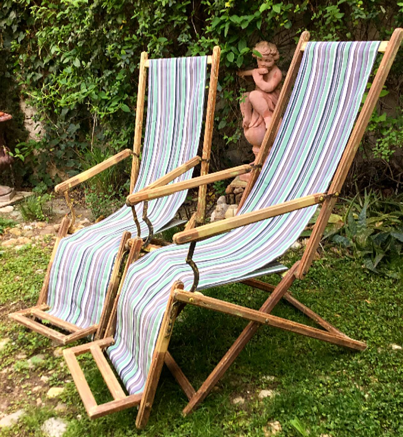 Pair of 19th-century wooden deck chairs with pegged frames and wrought iron