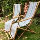 Pair of 19th-century wooden deck chairs with pegged frames and wrought iron
