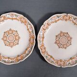 Two 18th century earthenware plates with grand feu decoration in ochre, green and manganese