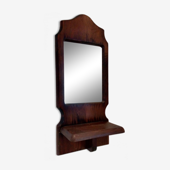 Wooden wall mirror with its shelf