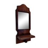 Wooden wall mirror with its shelf