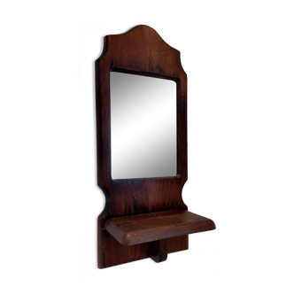 Wooden wall mirror with its shelf