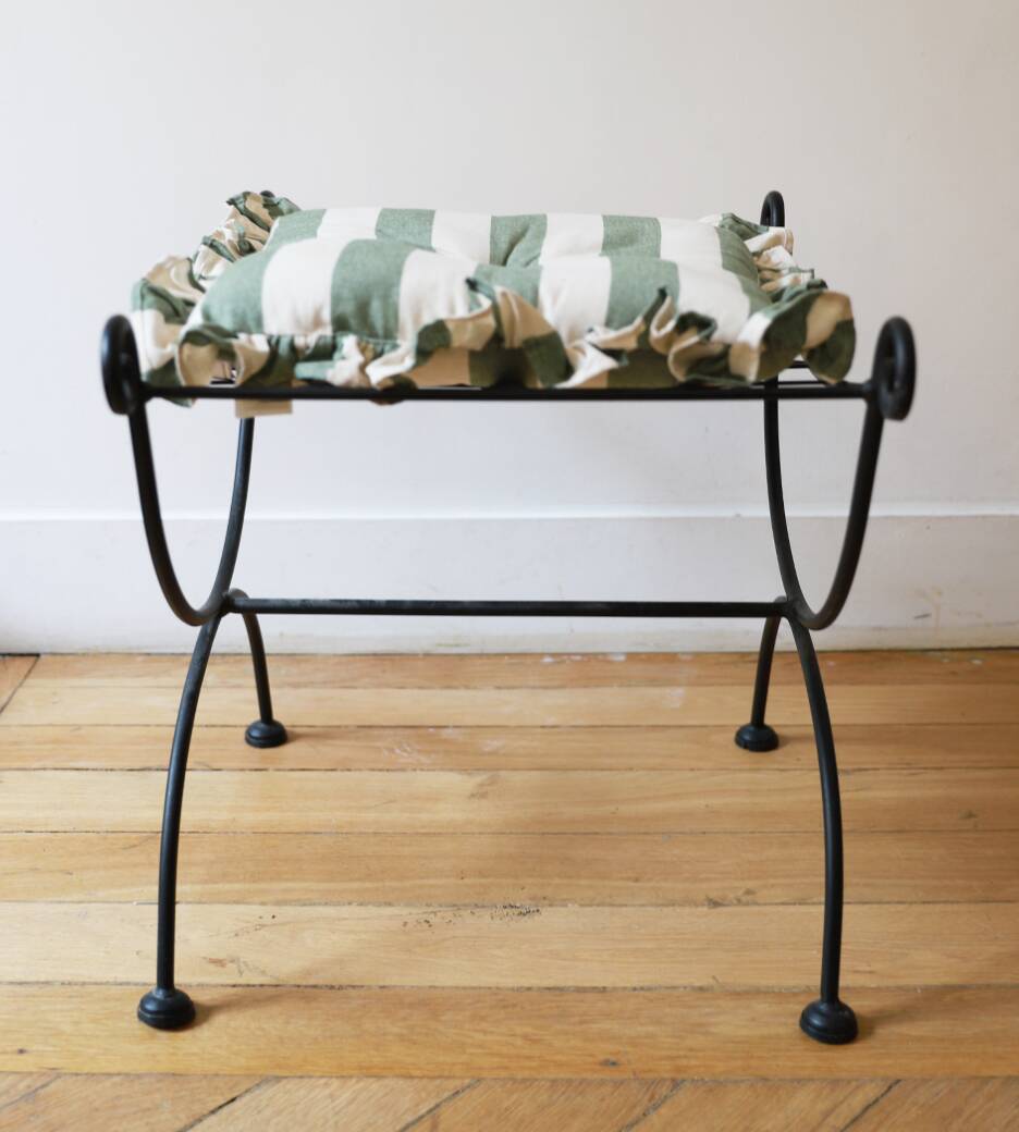 pair of wrought iron stools with cushions