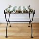pair of wrought iron stools with cushions