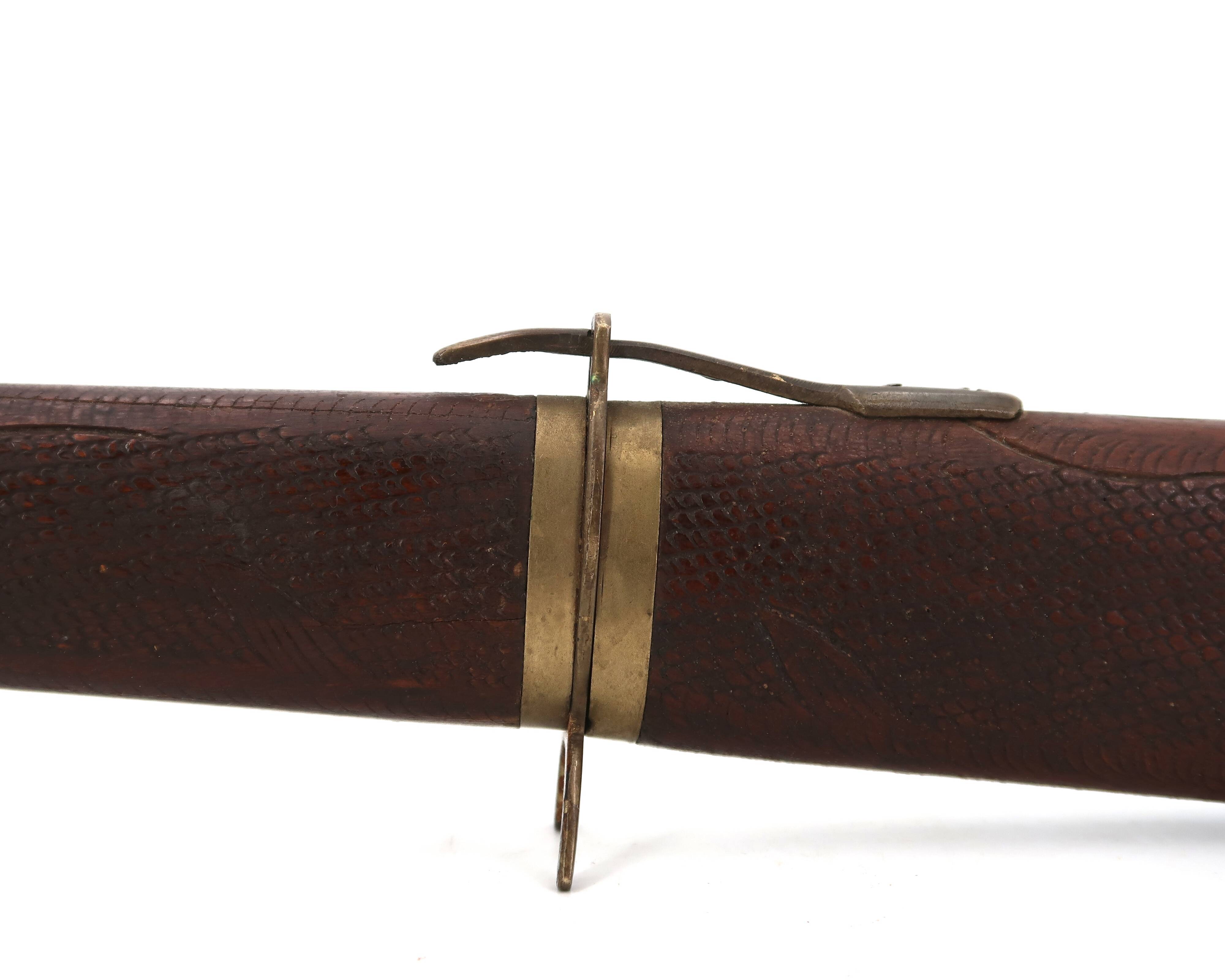 Fish knife and fork with a wooden and brass sheath sculpture.