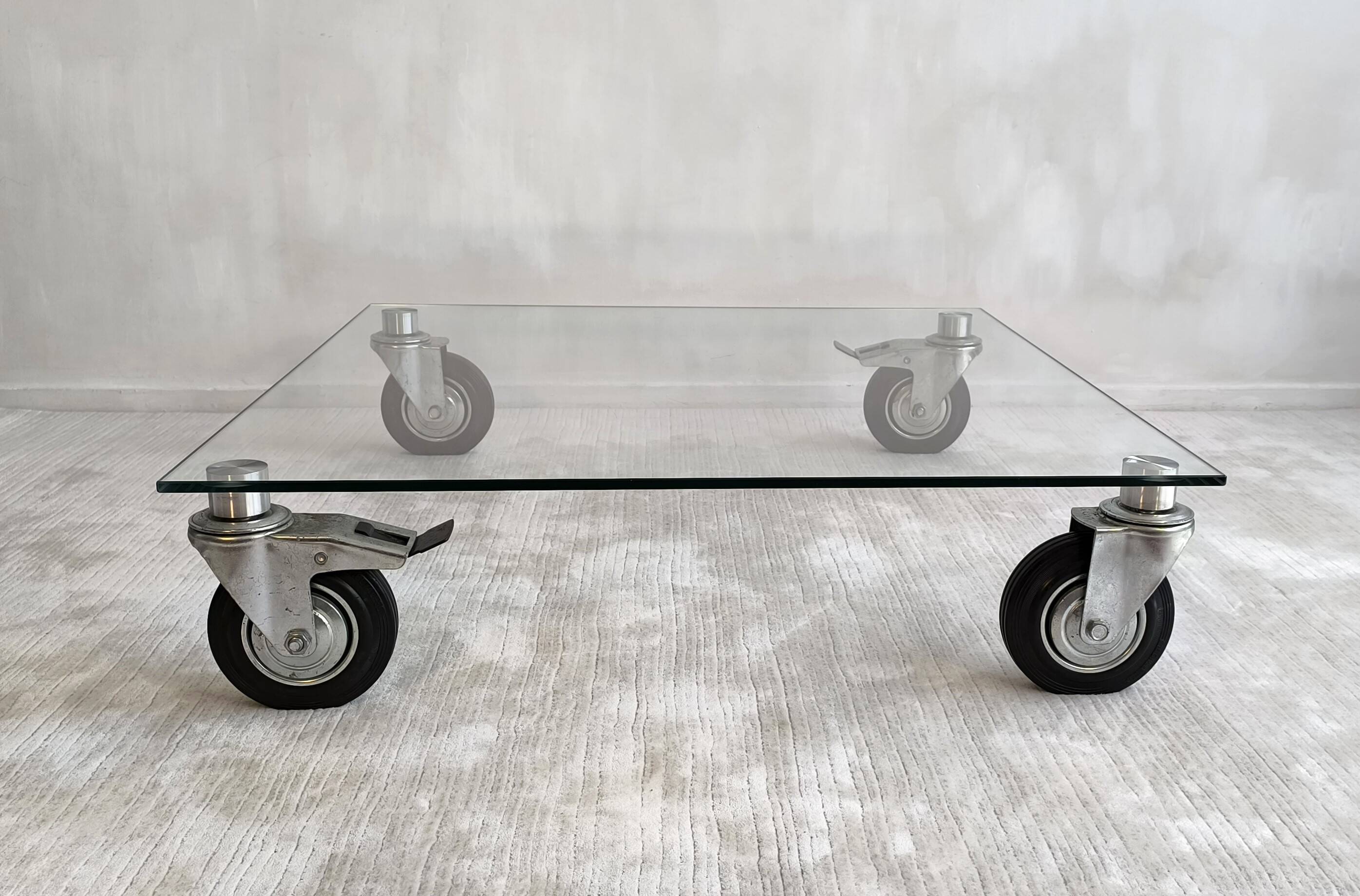 Beautiful designer glass coffee table on wheels
