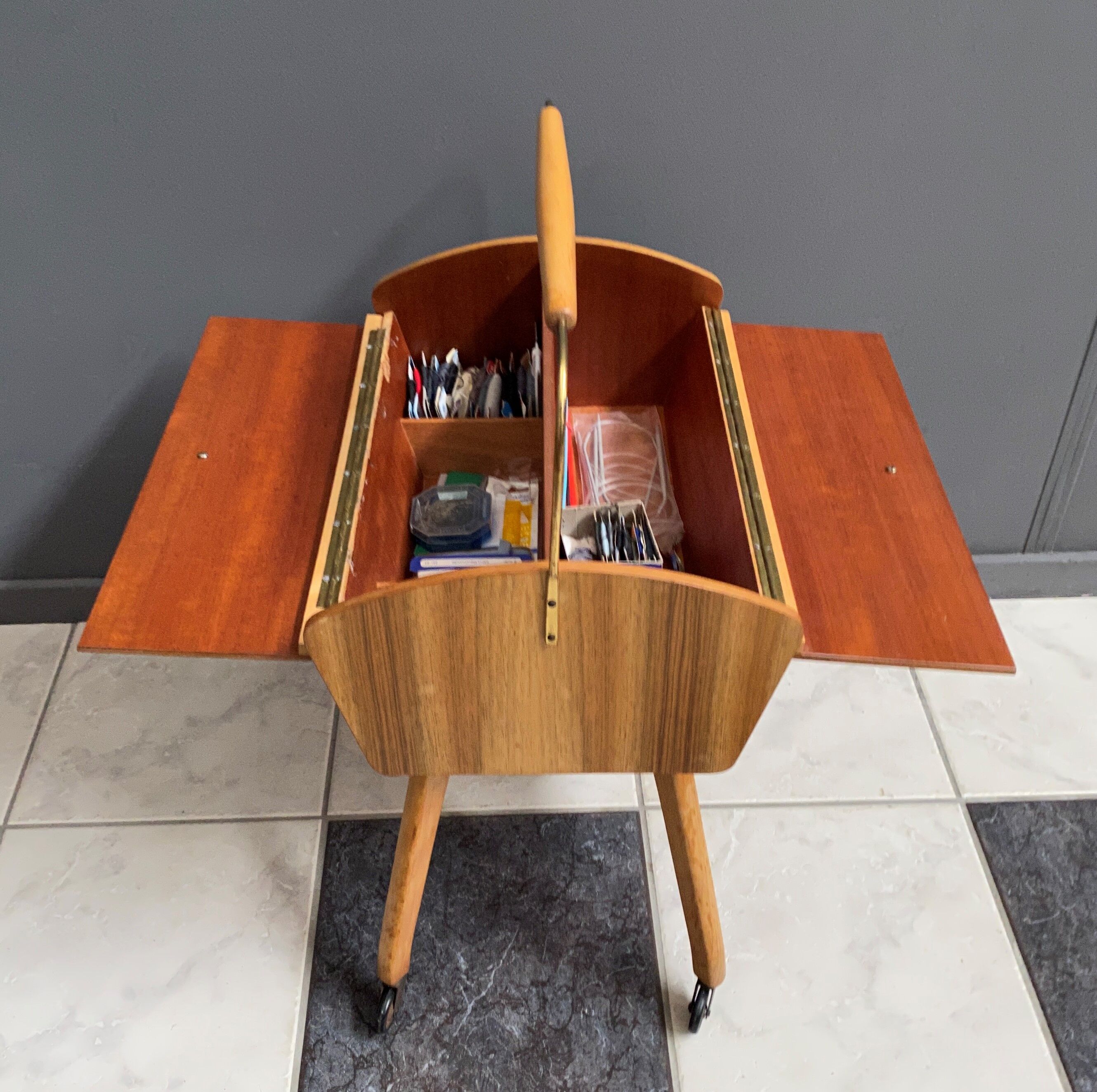 Sewing box on legs and wheels