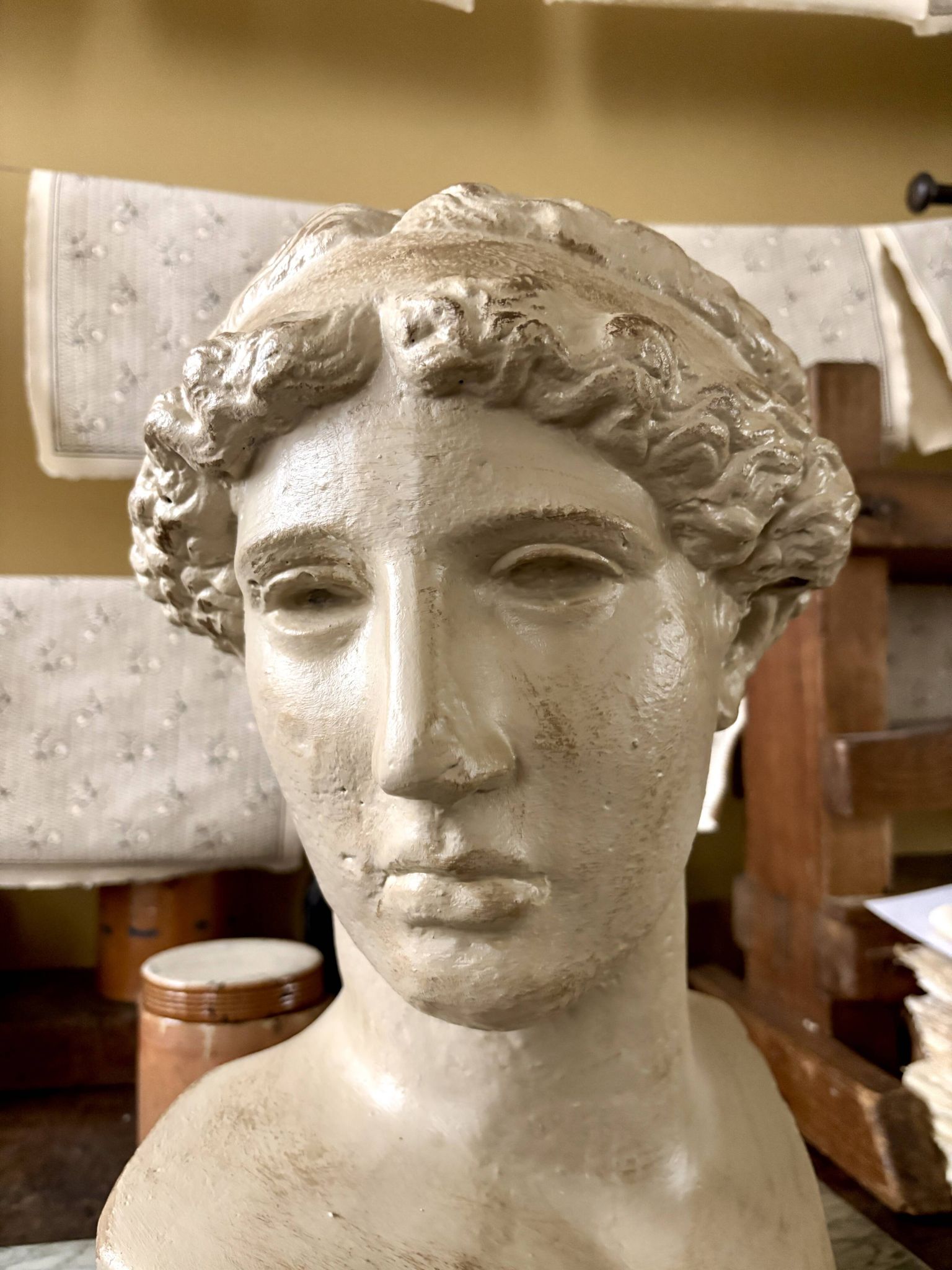 Concrete bust painted in beige - reproduction, detail of "The Dying Slave"